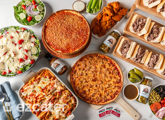Rosati’s catering spread with pizzas, sandwiches, salads, wings and sides