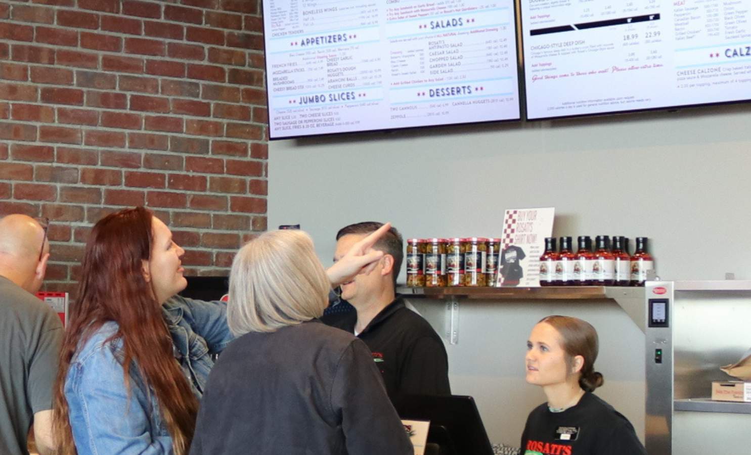 Customers Looking at Menu