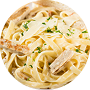 Fettuccine Alfredo with grilled chicken and parsley