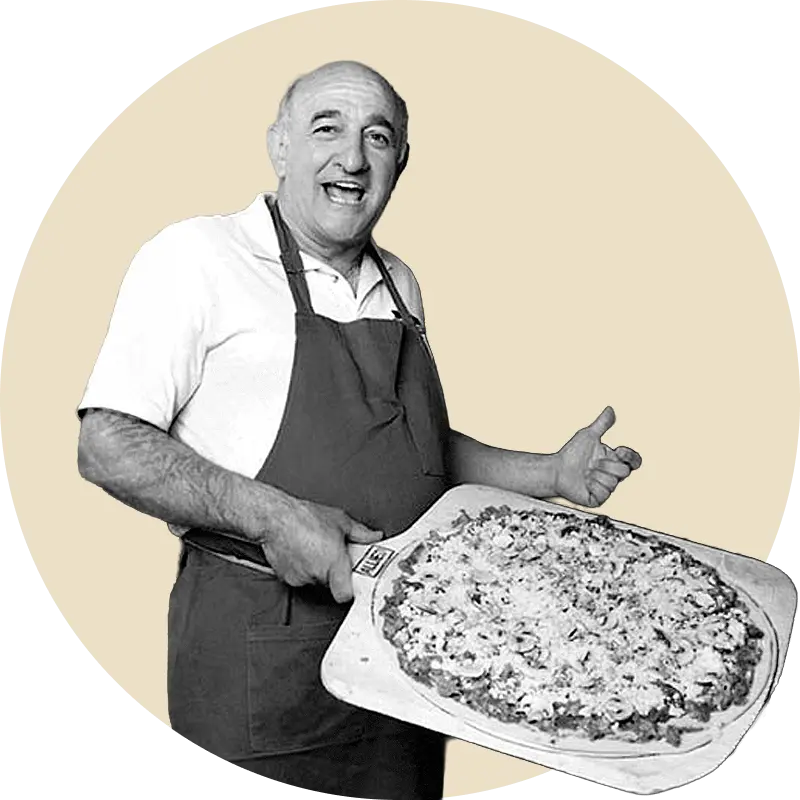 Rosati’s pizza maker holding a Chicago-style pizza
